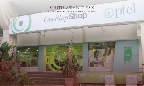 The exterior of an PTCL OneStopShop store with a sign and promotional posters in the windows.