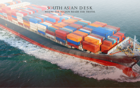 A large cargo ship loaded with colorful shipping containers sailing on the ocean.