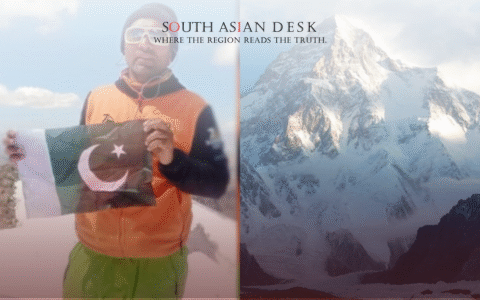 A person in an orange jacket and green pants holding a Pakistani flag on a snowy mountain, with a photo of a snow-covered peak beside them.