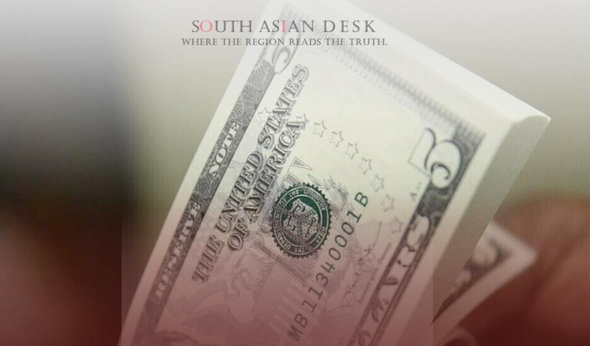 Pakistan’s Spy Agency Cracks Down on Black Market Dollar Trade to Stabilize Rupee 1 A close-up image of a U.S. dollar bill, showcasing green currency with detailed designs and text.