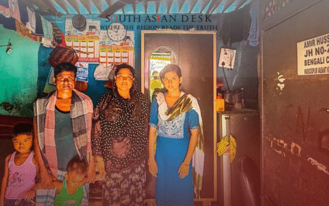 Indian family standing and posing for a photo, who faced immigration raids