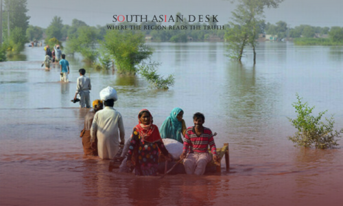Families from Punjab Pakistan walking in flood water after the announcement of Punjab flood relief