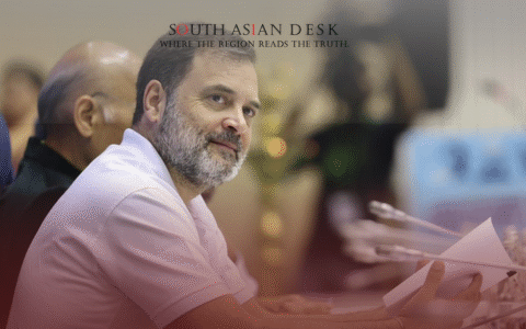 Indian Congressman Rahul Gandhi looking to his right posing for a photo after labelling tariffs as economic blackmail