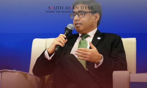 Indian diplomat misri sitting on a sofa holding mic