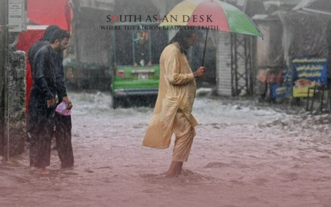 Two Men walking in flooded street amid heavy rainfall warnings
