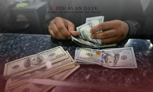 A man counting US dollars depicting currency crisis of Pakistan