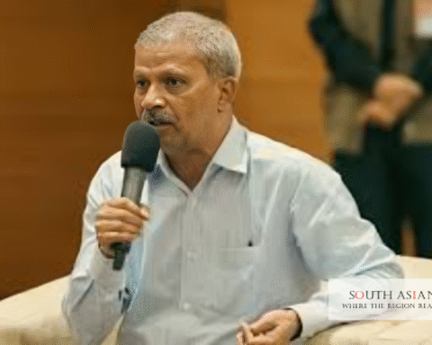 A man is speaking to a ceremony about Bangladesh Government NCC Reforms
