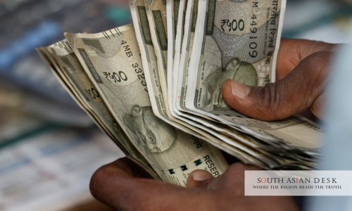 Indian Rupee Holds Steady position in hands of a person